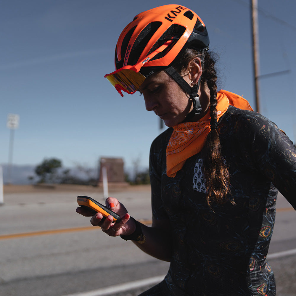 Isabel King holding a Karoo 2 with an orange Custom Color Kit