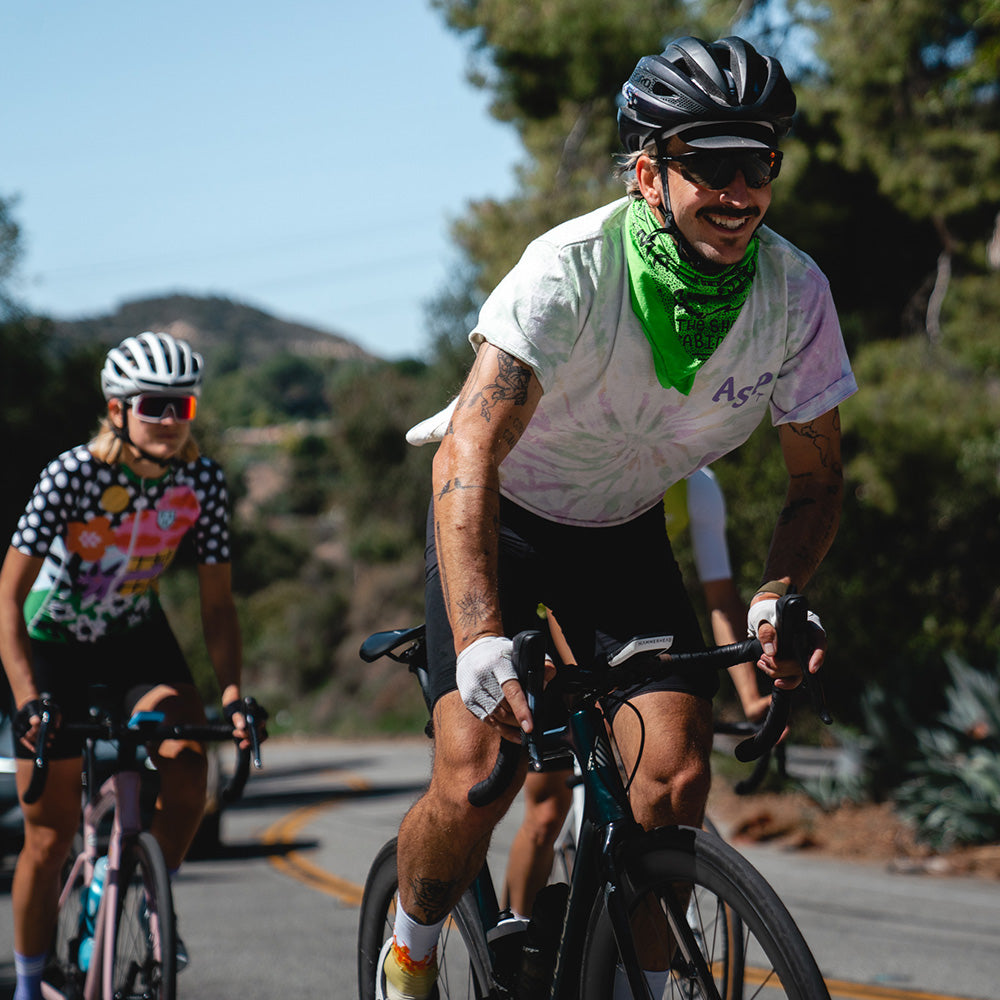 A male and female cyclist, both riding with Karoo 2 Custom Color Kits.